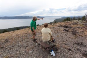 Hikers enjoying a lake view