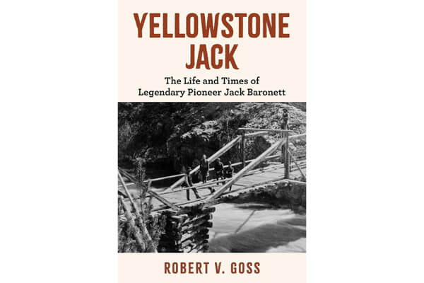 Book cover for Yellowstone Jack by Robert V. Goss, featuring a black and white photo of a man crossing a rustic wooden bridge over a river, with rocky, forested surroundings in the background.